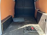 an image of the inside of a van with the door open