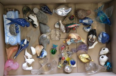 a cardboard box filled with assorted glass ornaments