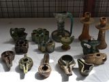 many different types of vases sitting on a table