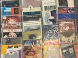 a lot of cd ' s that are on the table