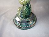 a figurine of a turtle sitting on a base