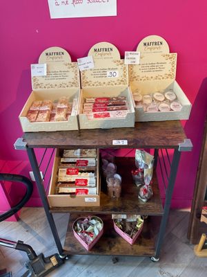 many boxes of food sitting on a table in a store