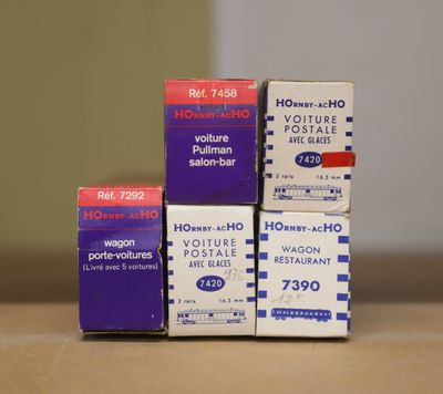 three boxes are stacked on top of each other on a table