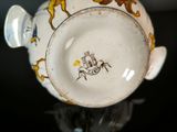 a close up of a cup with a horse on it