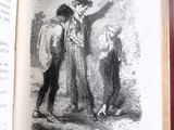 un livre ouvert sur lequel figure l'image d'un homme et d'un enfant