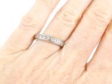 an image of a woman ' s hand with a wedding ring