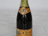 a bottle of wine that is sitting on a table
