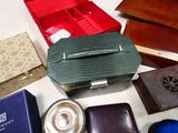 many different types of purses and wallets laid out on a table