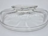 a clear glass container with a lid on a white surface