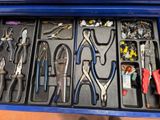 many different types of pliers in a tool box