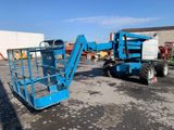 a picture of a blue scissor sitting in a parking lot