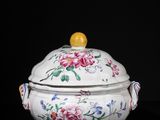 an image of a white bowl with flowers on it on a black surface