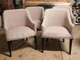 two chairs sitting next to each other in a room