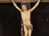 a wooden cross with a crucifix on top of it