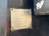 a close up of a sign on a metal object