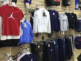 a lot of clothes on display in a store