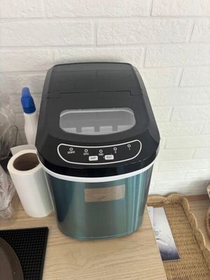 an image of a small ice cream maker on a table