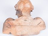 wooden sculpture of a man ' s head and shoulders on a white background