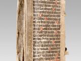 an old book with writing on it sitting on top of a table