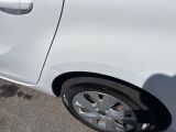 a white car that is parked on the side of the road