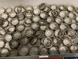 a box full of silver spoons sitting on a table