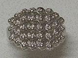 an image of a close up of a silver ring on a table