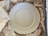 a white plate that is sitting in a box