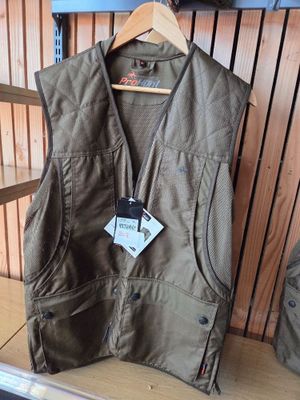 a brown vest with a tag on it sitting on a shelf