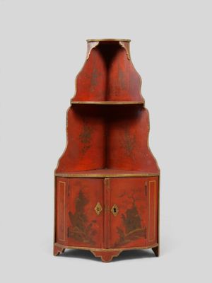 une image représentant une armoire rouge à deux portes et deux tiroirs