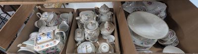 a lot of plates and bowls in a box