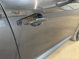 a remote control on the door handle of a car