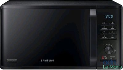 Le four à micro-ondes Samsung est noir et dispose d'un minuteur sur le côté.