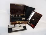 a small wooden box with a mirror and a watch in it