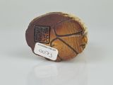 wooden figurine of a basketball ball with chinese writing on it