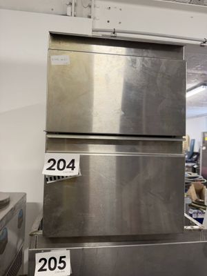 several stainless steel refrigerators stacked on top of each other in a kitchen
