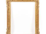 a gold frame with a white background and a white wall