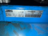 a label on the back of a blue machine