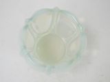 a glass bowl that is sitting on a table