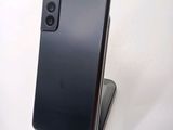 the back of a black phone is sitting on top of a stand