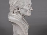 marble bust of a man with a short haircut