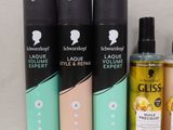 several different types of hair products are displayed on a shelf