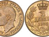 a gold coin with a crown on top of it