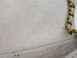 a close up of a purse with a chain on it