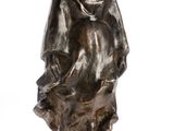 an image of a statue of a man playing a trumpet