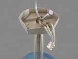 a blue bowl with wires attached to it on a stand