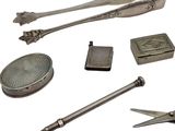 a collection of antique silver objects on a white background