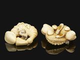 pair of carved ivory nets of a man and woman on a shell