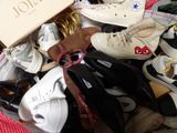 many pairs of shoes that are sitting in a box