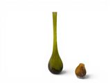 a vase and a figurine sitting next to each other