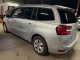 a silver car that is parked in a garage